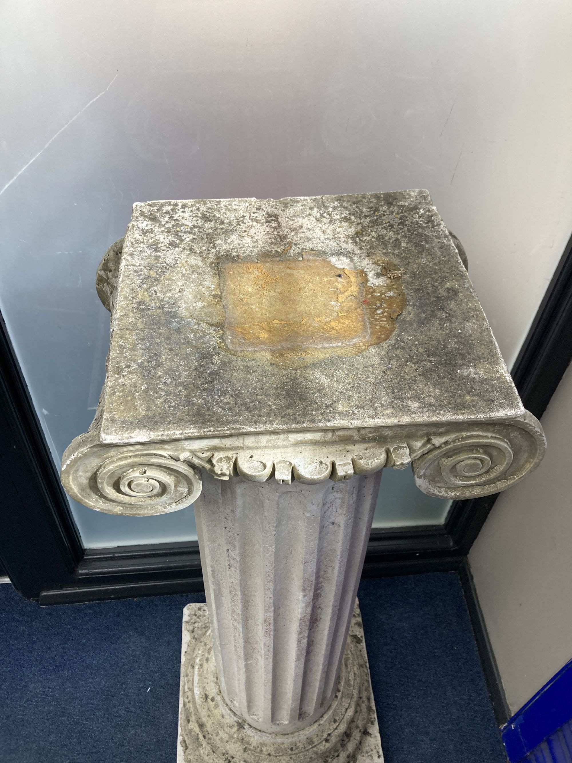 A reconstituted stone ionic garden pedestal, width 39cm, height 104cm